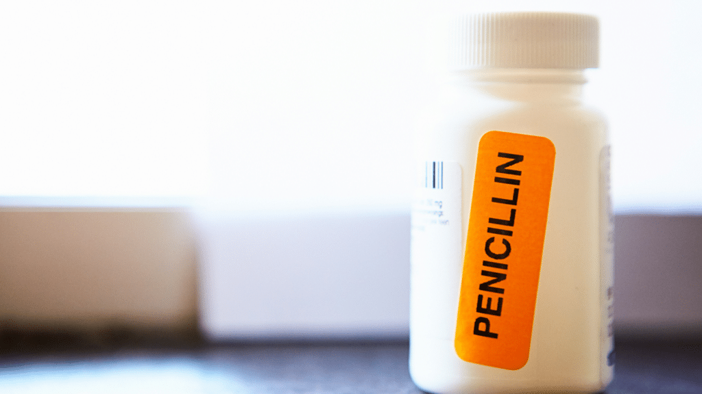 Pharmacist has stuck a bright orange sticker on a container of antibiotics to draw attention to the fact that they contain penicillin, to which some people are allergic.
